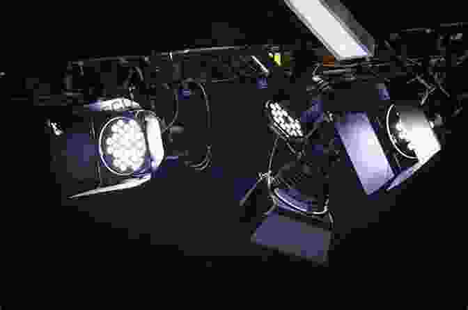 A Cinematographer Adjusting Lighting Equipment, Showcasing Lighting Techniques Digital Filmmaking (Digital Filmmaker Series)