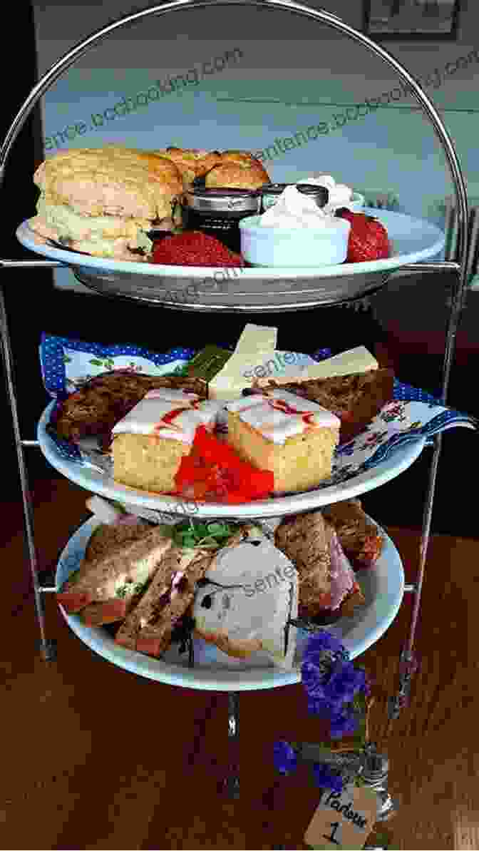 A Delightful Spread Of Afternoon Tea With Delicate Sandwiches, Scones, And Pastries Served On A Tiered Stand Let S Learn About England : History For Children Learn About English Heritage Perfect For Homeschool Or Home Education (Kid History 11)