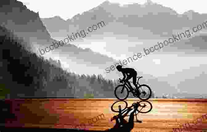 Cyclist Riding Through A Stunning Mountain Landscape Distance Cycling John Hughes