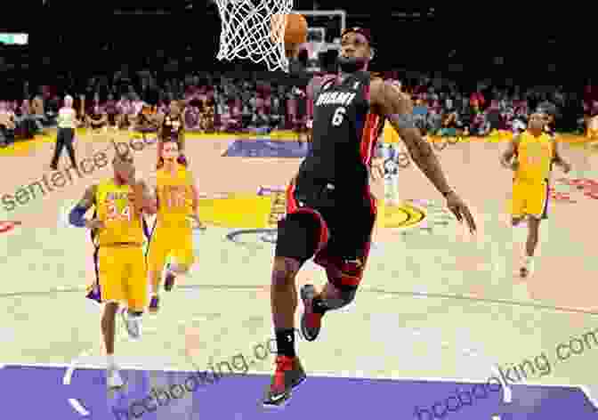 LeBron James Performing A Thunderous Dunk, Showcasing His Athleticism And Power. LeBron James: Basketball Superstar (Superstar Athletes)